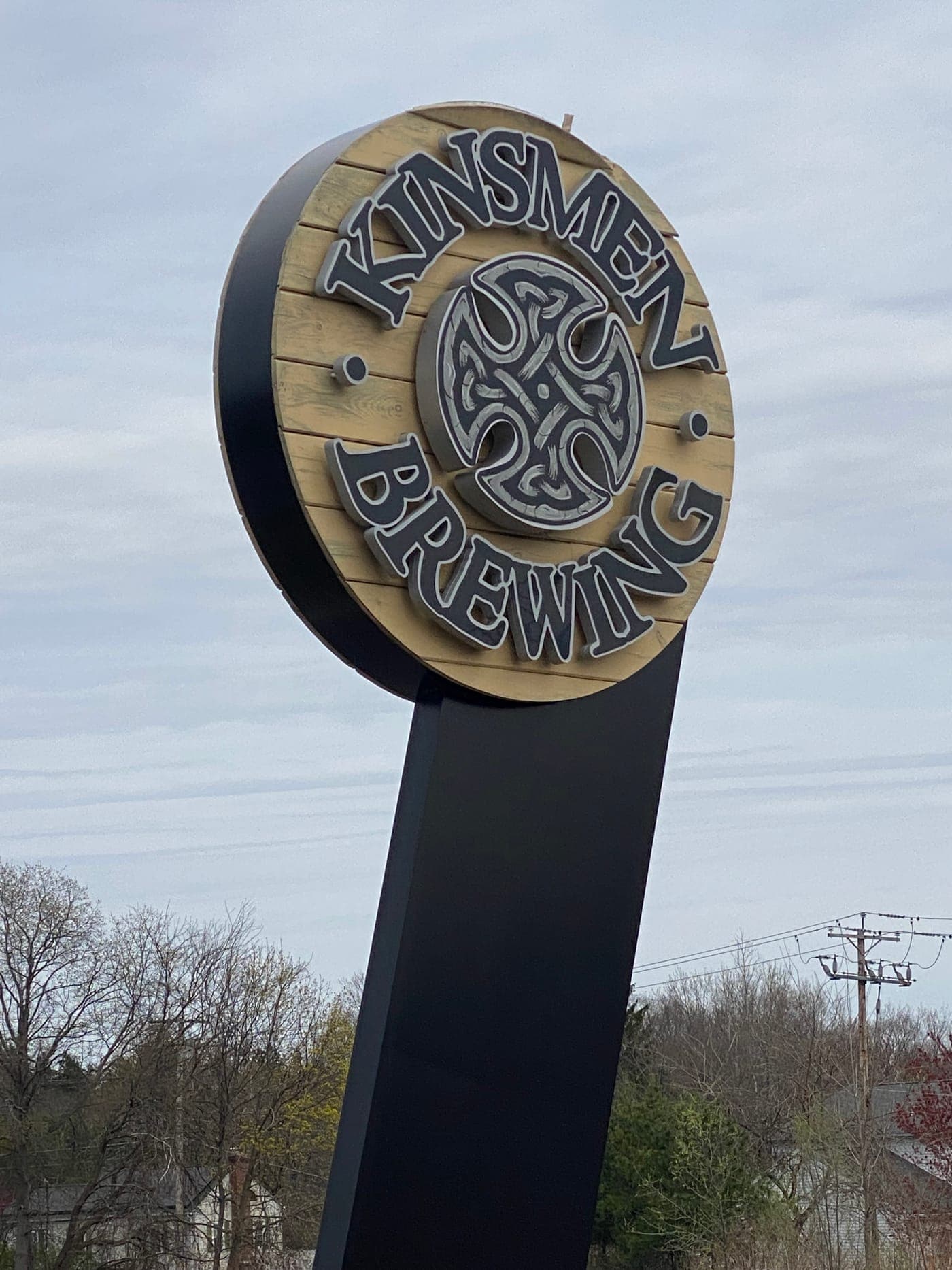 Kinsmen Brewing barrel-style Celtic sign at brewery serviced by Pals Power Washing