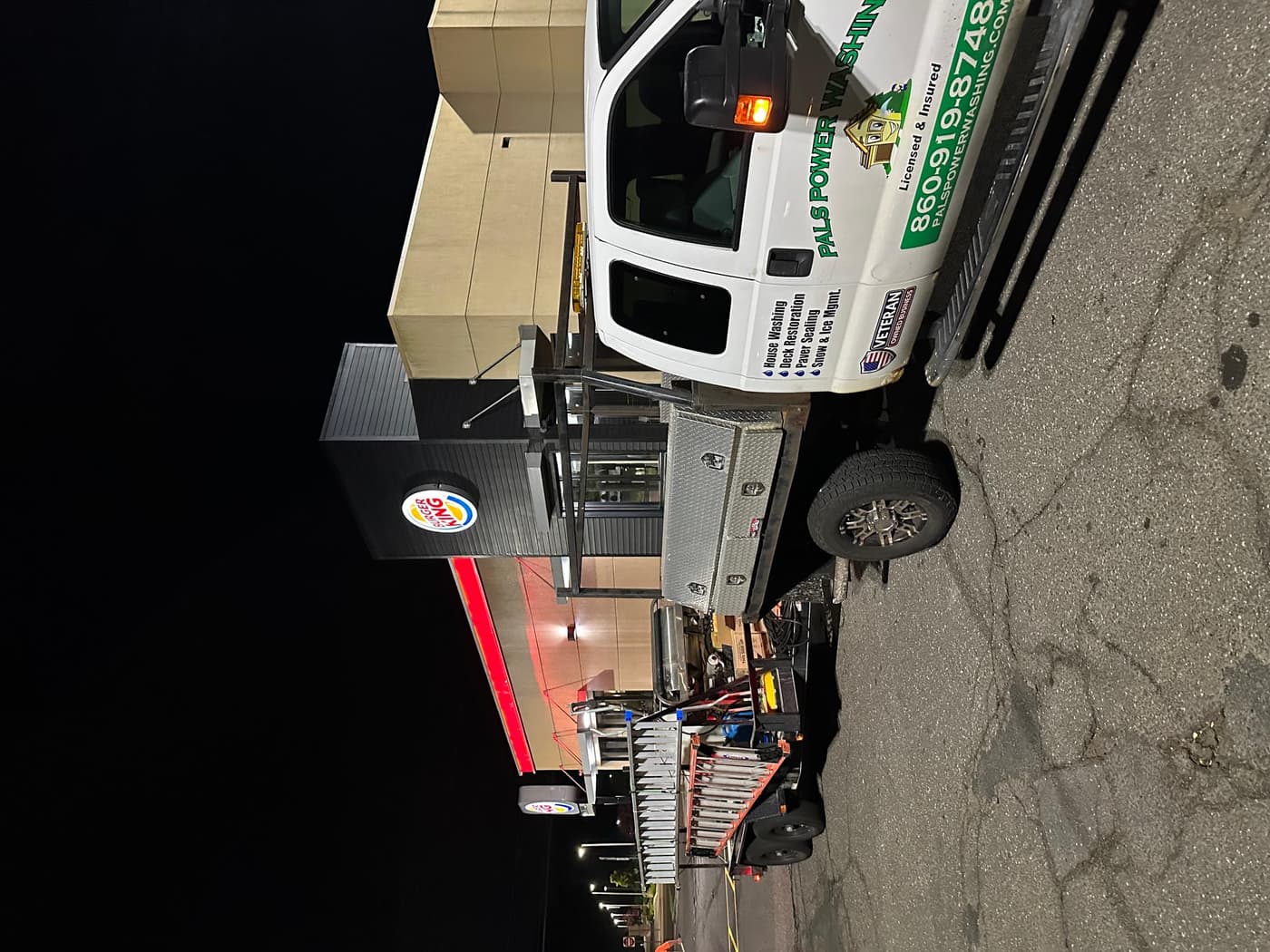 Pals Power Washing truck and trailer on a commercial night job